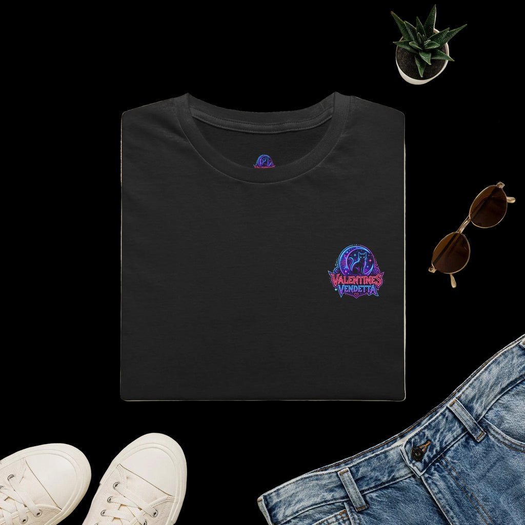 Navy blue t-shirt with 'CV27' logo on a light surface with accessories like a hat, sunglasses, and shoes.