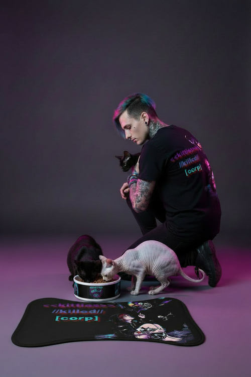 Kittie Killz Lifestyle - Bowl on Mat with Sphinx and Black Cat eating from it Model feeding them with kittie killz shirt 